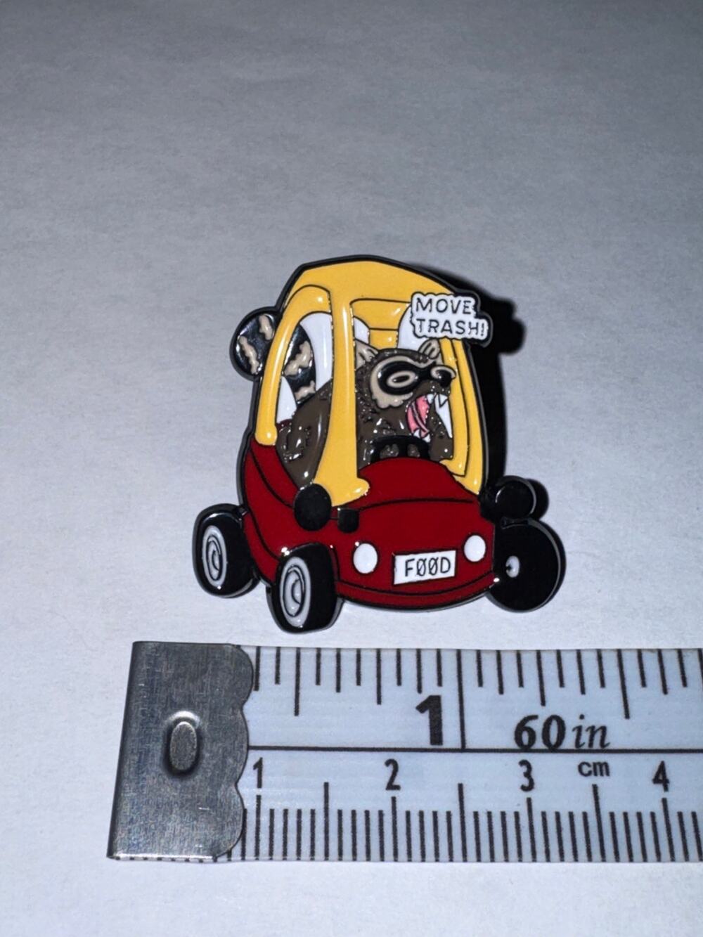 Raccoon in Child’s Toy Car Pin Brooch